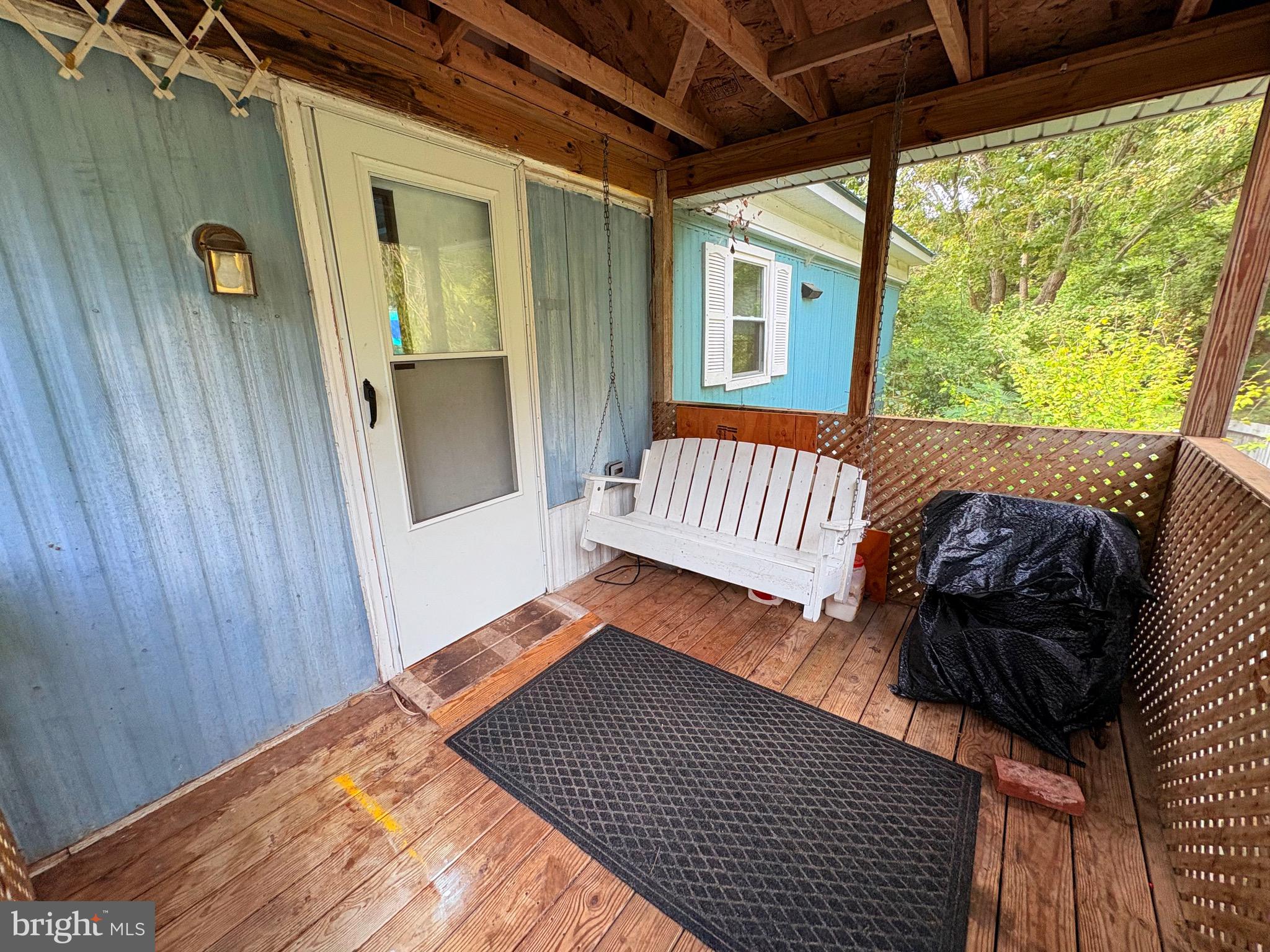 27199 Nevitte Muir Road Westover, MD 21871 - Photo 3 of 31 a view of balcony with furniture