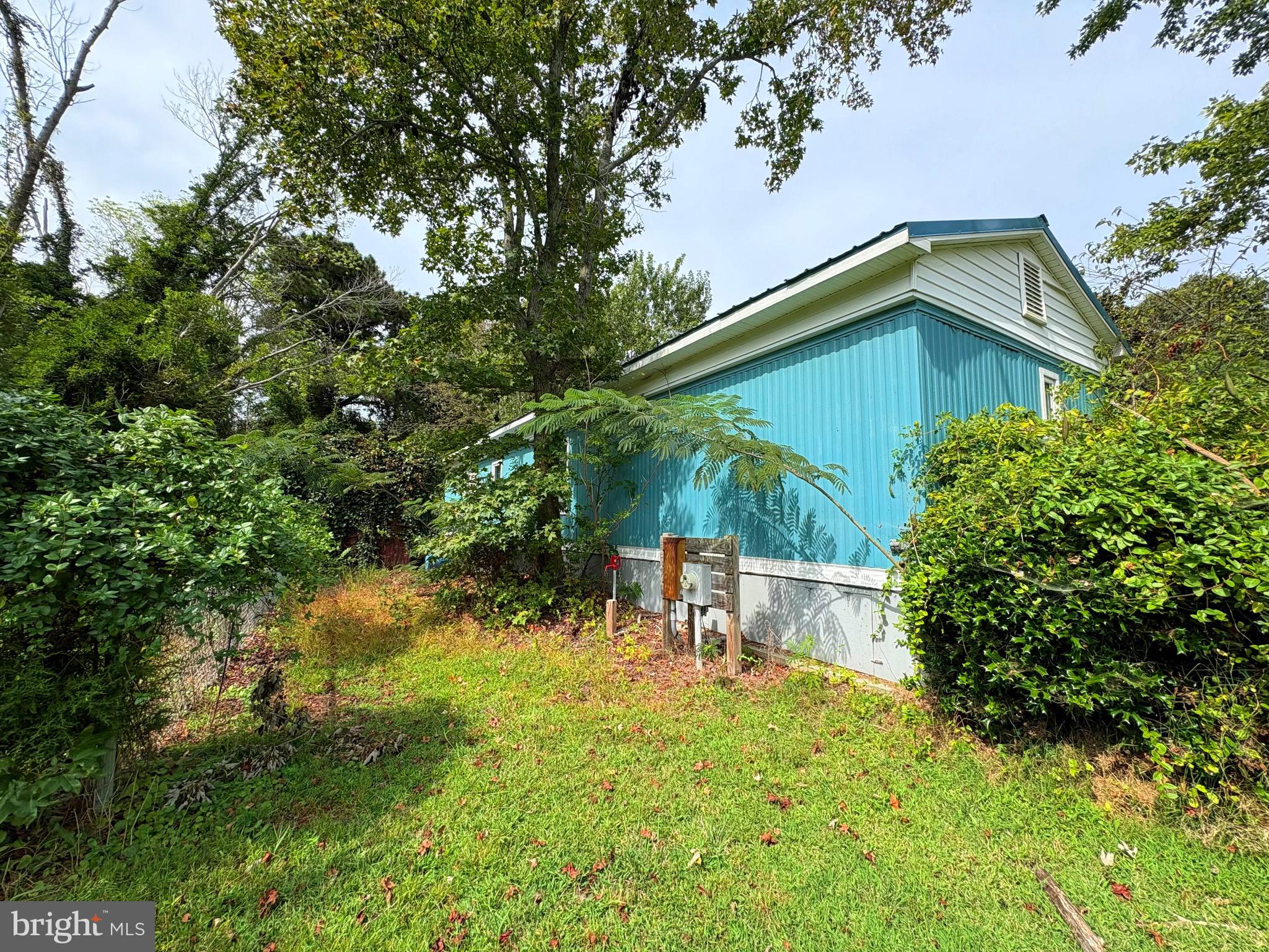 27199 Nevitte Muir Road Westover, MD 21871 - Photo 31 of 31 a backyard of a house with table and chairs