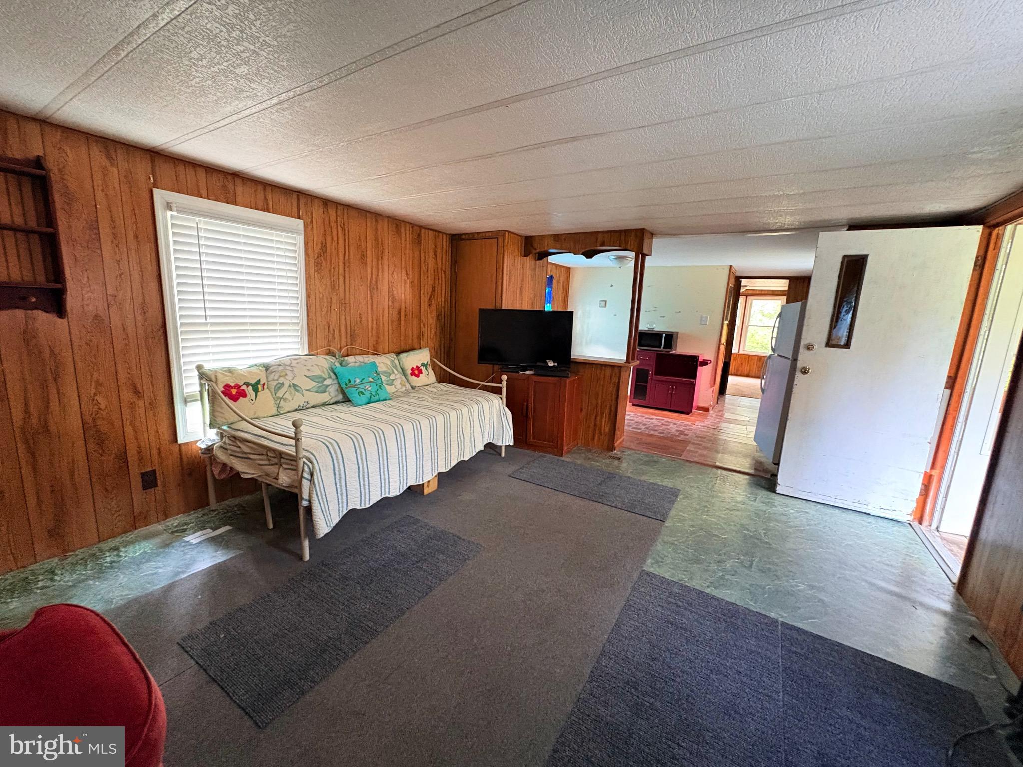 27199 Nevitte Muir Road Westover, MD 21871 - Photo 6 of 31 a living room with furniture and a flat screen tv