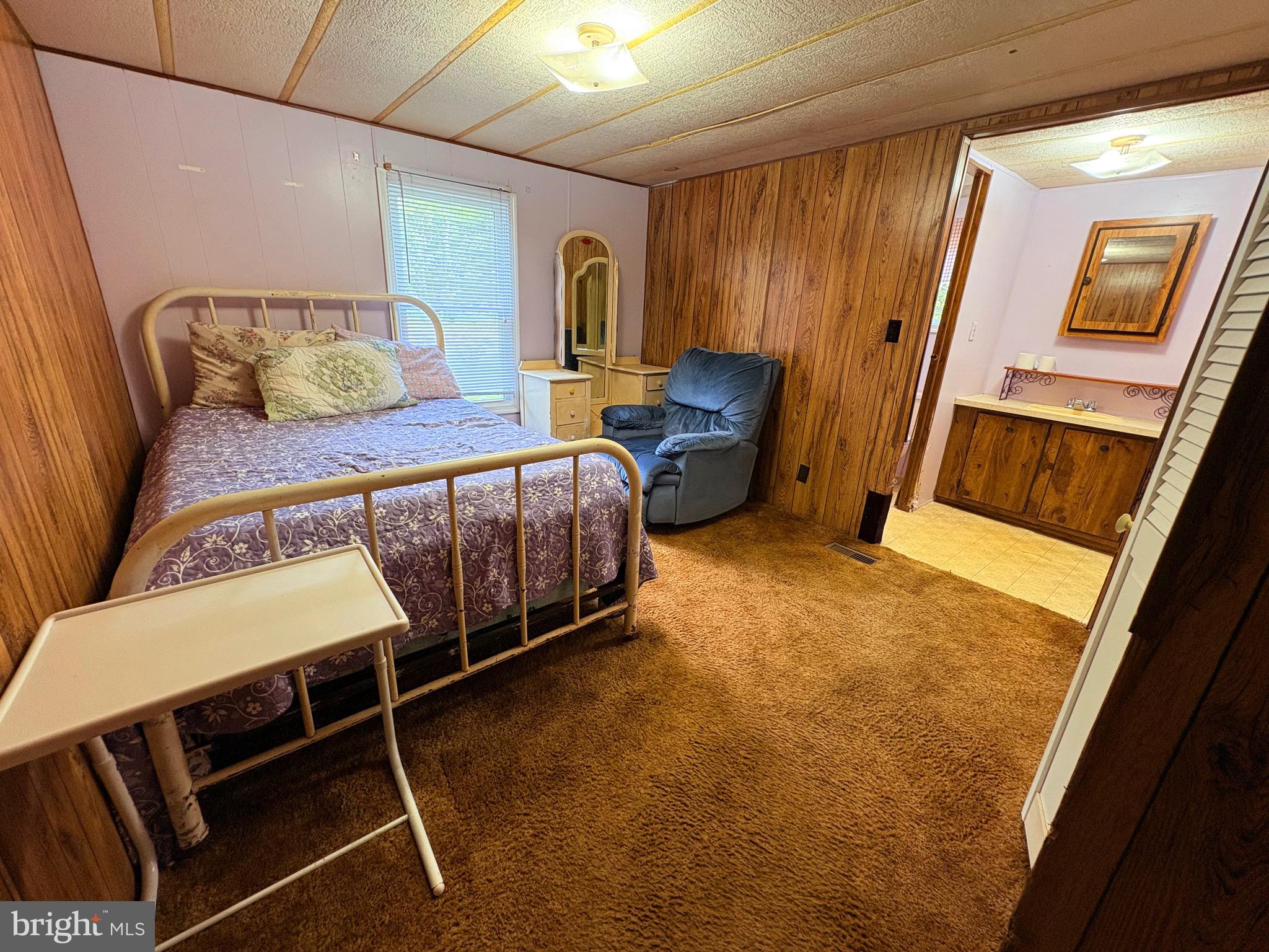 27199 Nevitte Muir Road Westover, MD 21871 - Photo 8 of 31 a bedroom with a bed and wooden floor