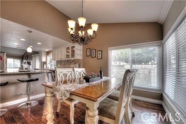 2543 Farview Road Fullerton, CA 92833 - Photo 7 of 15 a view of a dining room with furniture wooden floor and chandelier