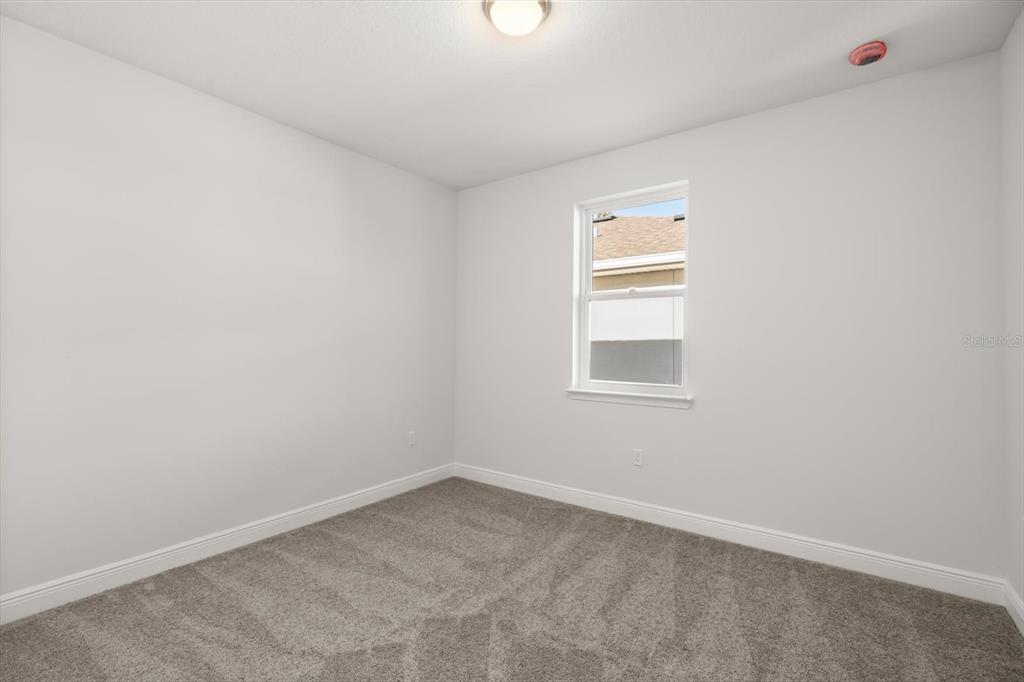 1289 Ash Tree Cove Casselberry, FL 32707 - Photo 20 of 34 a view of an empty room with a window