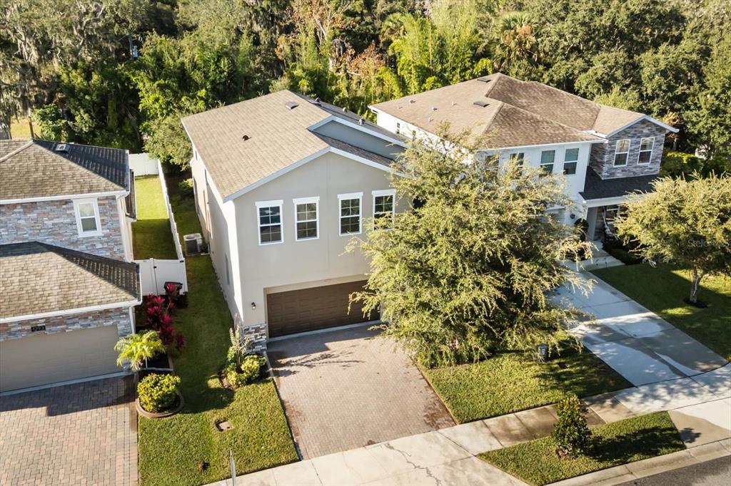 1289 Ash Tree Cove Casselberry, FL 32707 - Photo 2 of 34 a aerial view of a house with a yard and potted plants