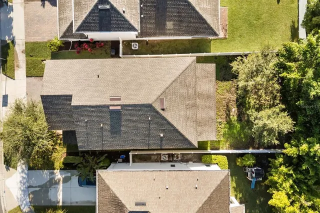 an aerial view of house with a swimming pool
