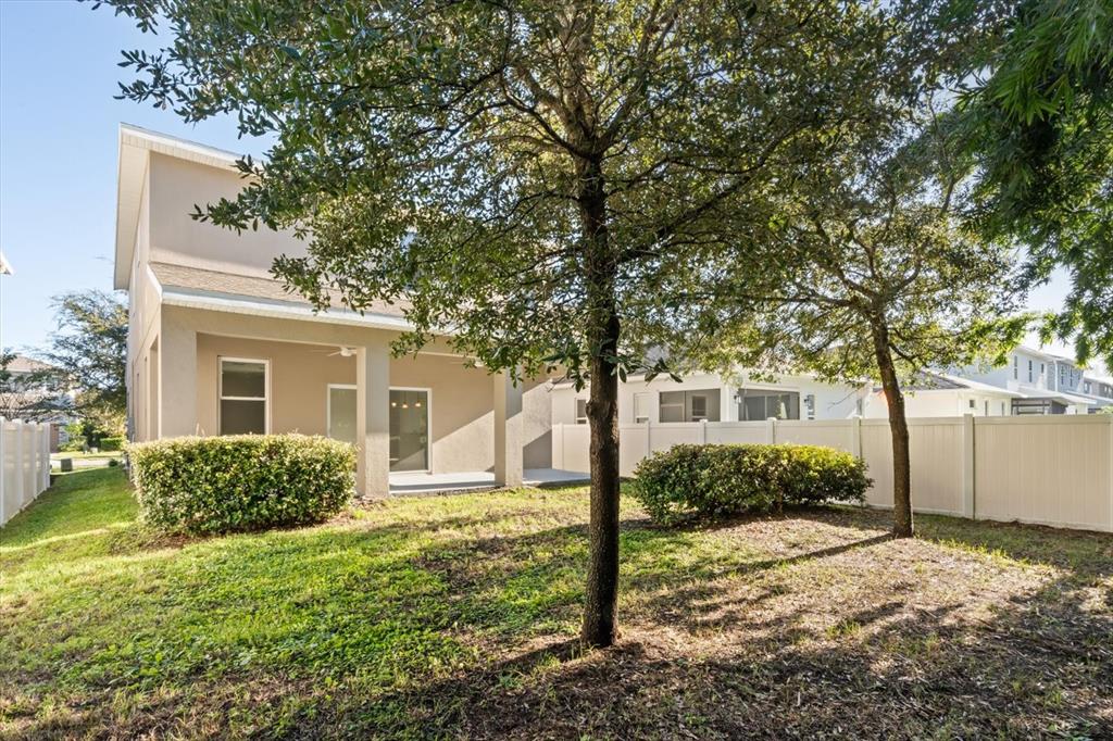 1289 Ash Tree Cove Casselberry, FL 32707 - Photo 33 of 34 front view of a house with a yard
