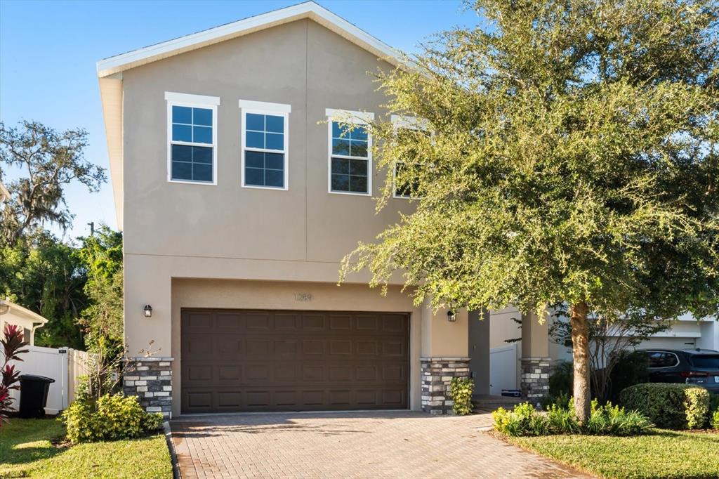 1289 Ash Tree Cove Casselberry, FL 32707 - Photo 34 of 34 a front view of a house with a garden