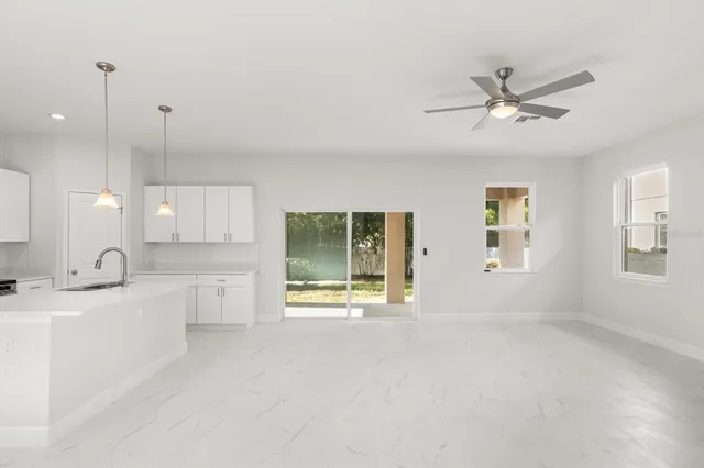 a view of a kitchen with a sink and a window