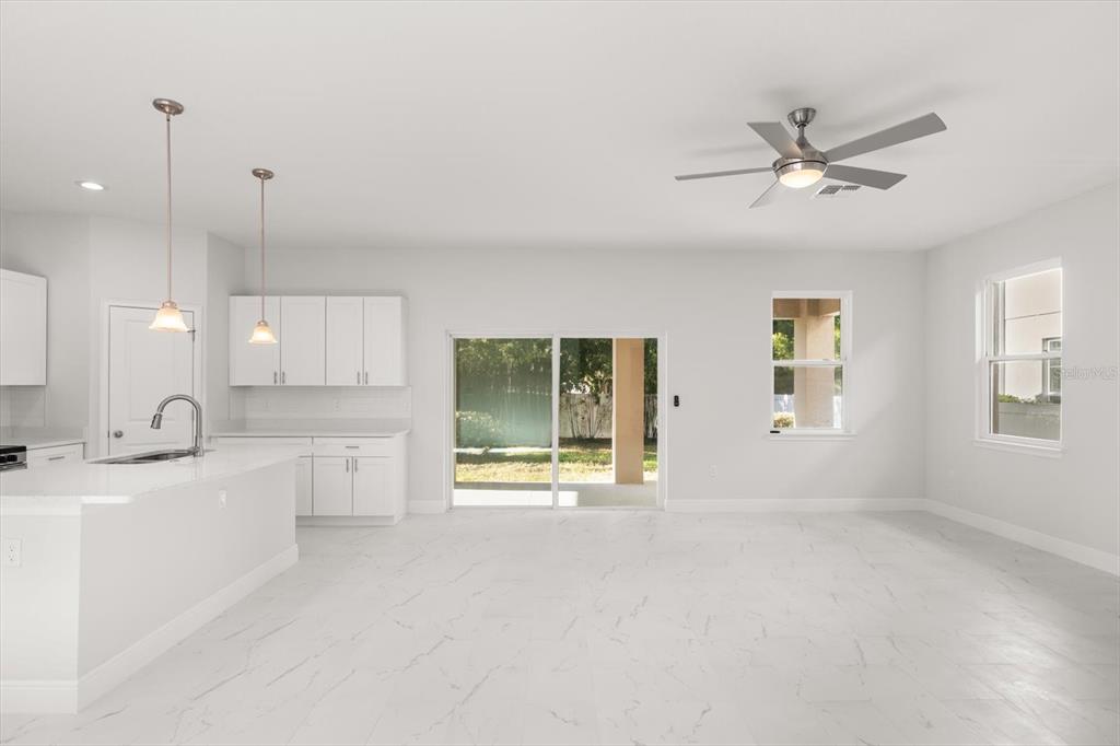 1289 Ash Tree Cove Casselberry, FL 32707 - Photo 9 of 34 a view of a kitchen with a sink and a window