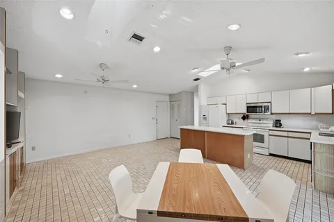 a large kitchen with cabinets