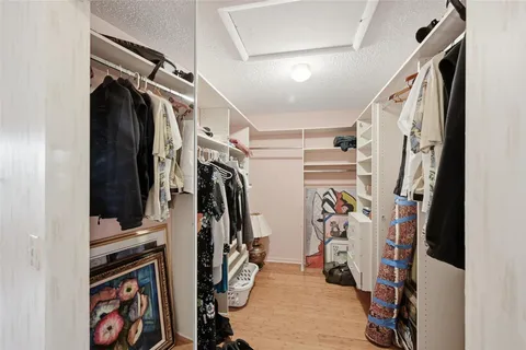 a front view of a house with yard and green space