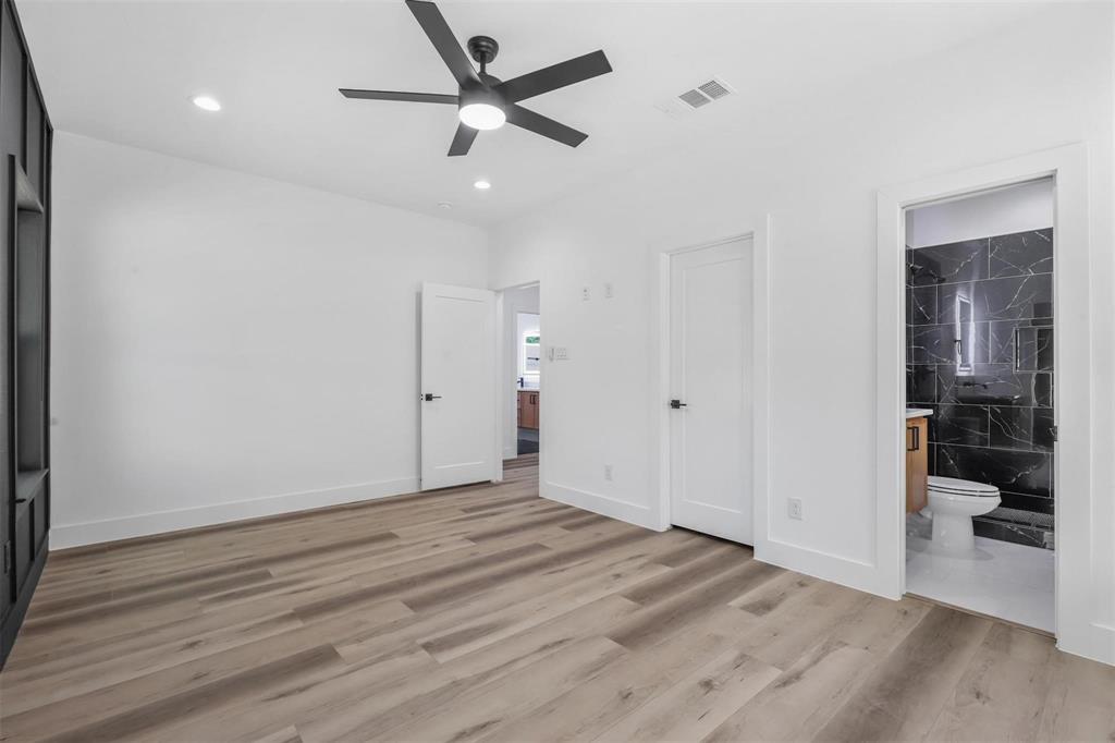 2714 Hector Street Dallas, TX 75210 - Photo 19 of 33 a view of a big room with wooden floor and a bathroom