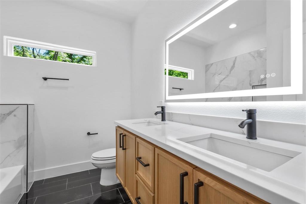 2714 Hector Street Dallas, TX 75210 - Photo 21 of 33 a bathroom with a sink and a toilet