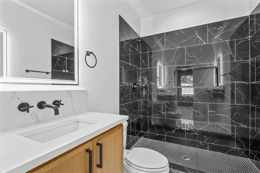 2714 Hector Street Dallas, TX 75210 - Photo 22 of 33 a bathroom with a sink toilet and shower