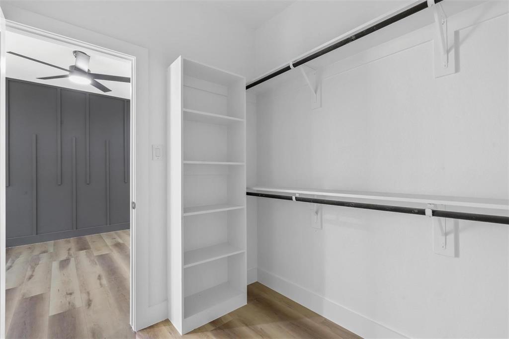 2714 Hector Street Dallas, TX 75210 - Photo 25 of 33 a view of walk in closet with empty racks