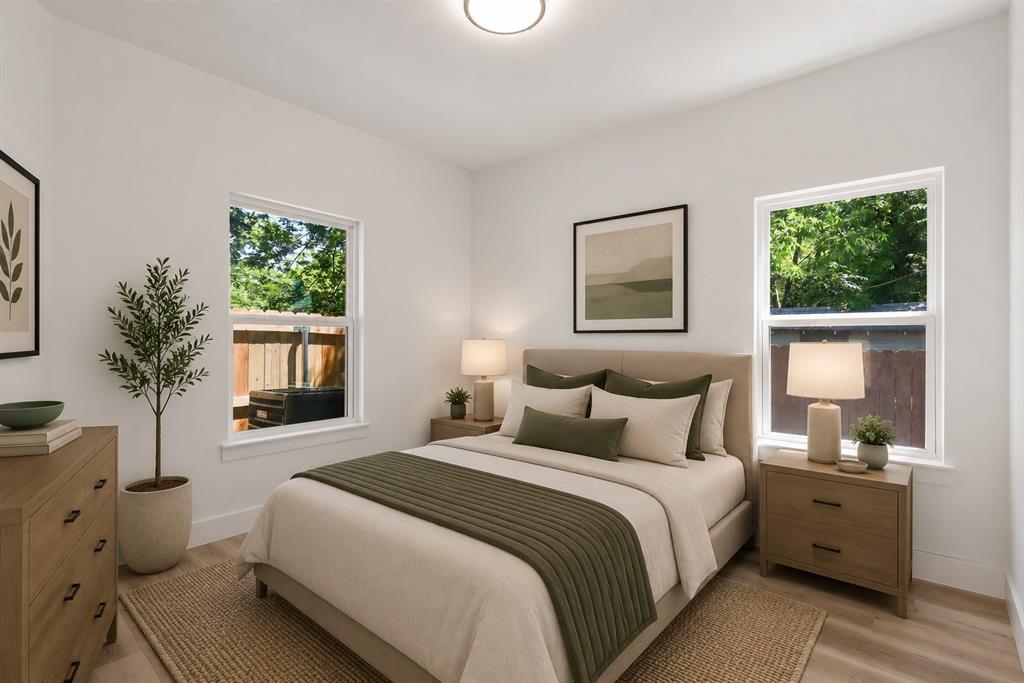 2714 Hector Street Dallas, TX 75210 - Photo 30 of 33 a spacious bedroom with a bed and a window