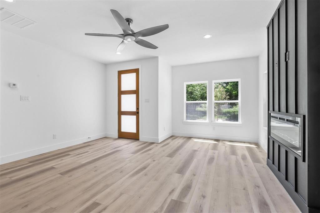 2714 Hector Street Dallas, TX 75210 - Photo 6 of 33 wooden floor in an empty room with a window