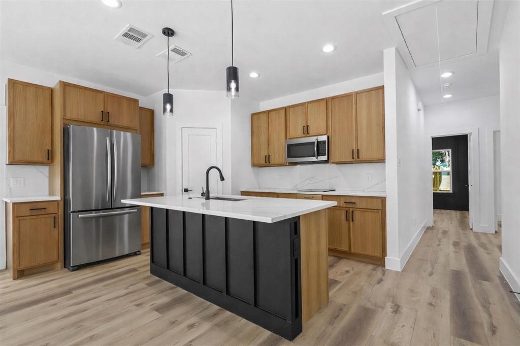 2714 Hector Street Dallas, TX 75210 - Photo 8 of 33 a kitchen with stainless steel appliances granite countertop a refrigerator a sink a stove and oven