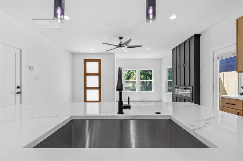 2714 Hector Street Dallas, TX 75210 - Photo 10 of 33 a view of a kitchen with a sink and a window