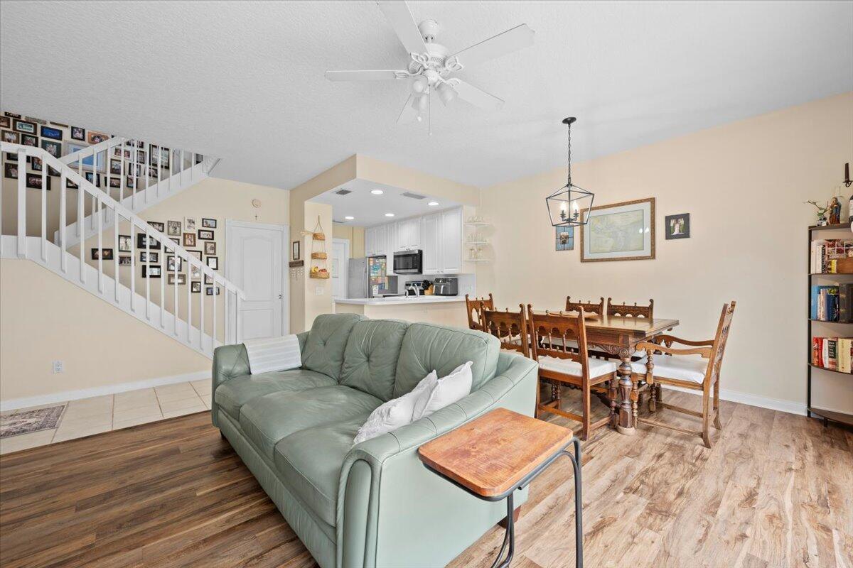 11 Live Oak Circle, Unit 11 Tequesta, FL 33469 - Photo 16 of 27 a living room with furniture and wooden floor