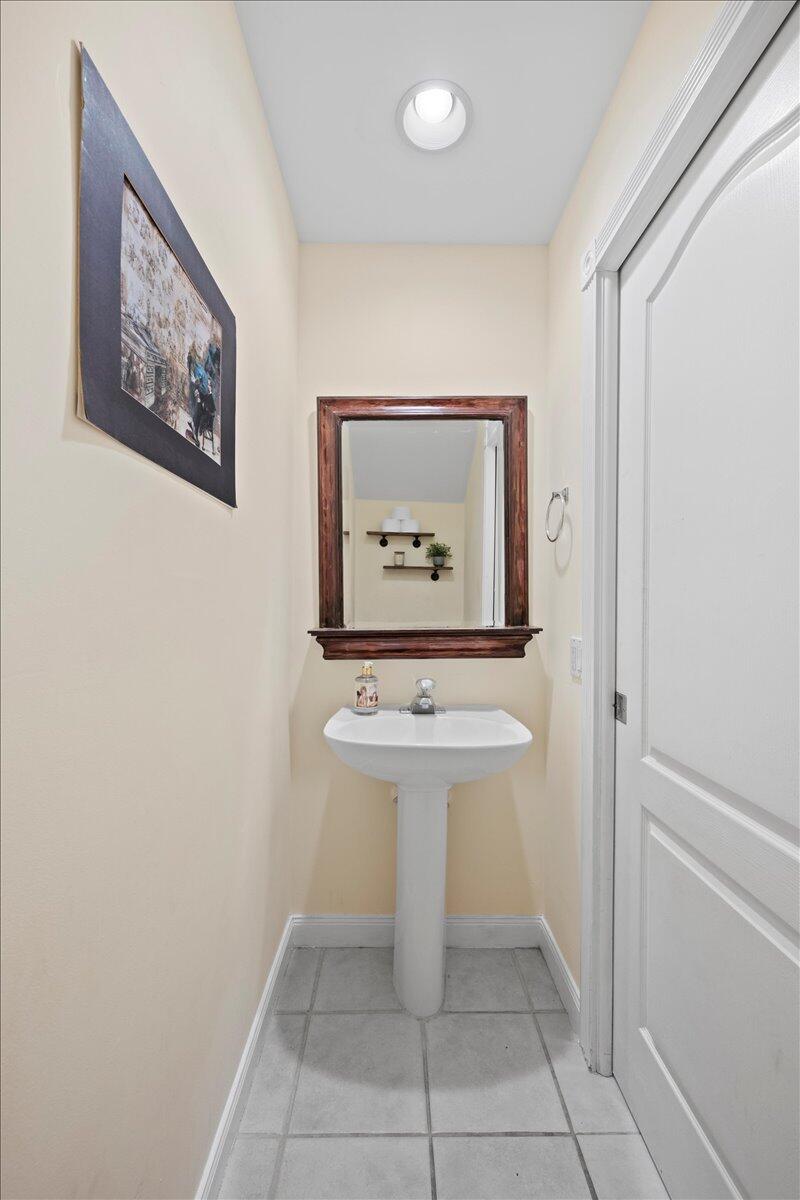 11 Live Oak Circle, Unit 11 Tequesta, FL 33469 - Photo 19 of 27 an entryway with table and mirror