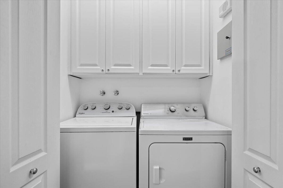 11 Live Oak Circle, Unit 11 Tequesta, FL 33469 - Photo 23 of 27 a utility room with dryer and washer