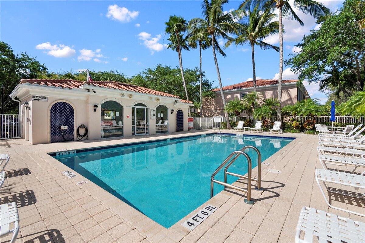 11 Live Oak Circle, Unit 11 Tequesta, FL 33469 - Photo 27 of 27 a view of a swimming pool with a seating space