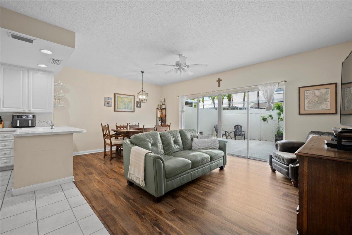 11 Live Oak Circle, Unit 11 Tequesta, FL 33469 - Photo 7 of 27 a living room with furniture and a large window