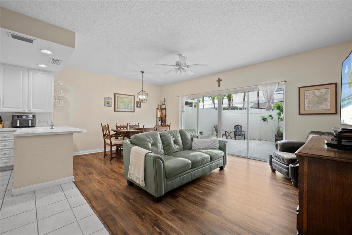 11 Live Oak Circle, Unit 11 Tequesta, FL 33469 - Photo 8 of 27 a living room with furniture and a large window