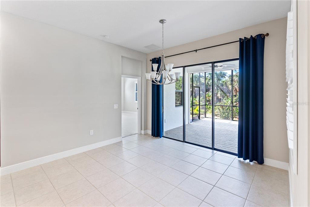 13017 Steinhatchee Loop Venice, FL 34293 - Photo 21 of 98 a view of a room with sliding glass door and chandelier fan
