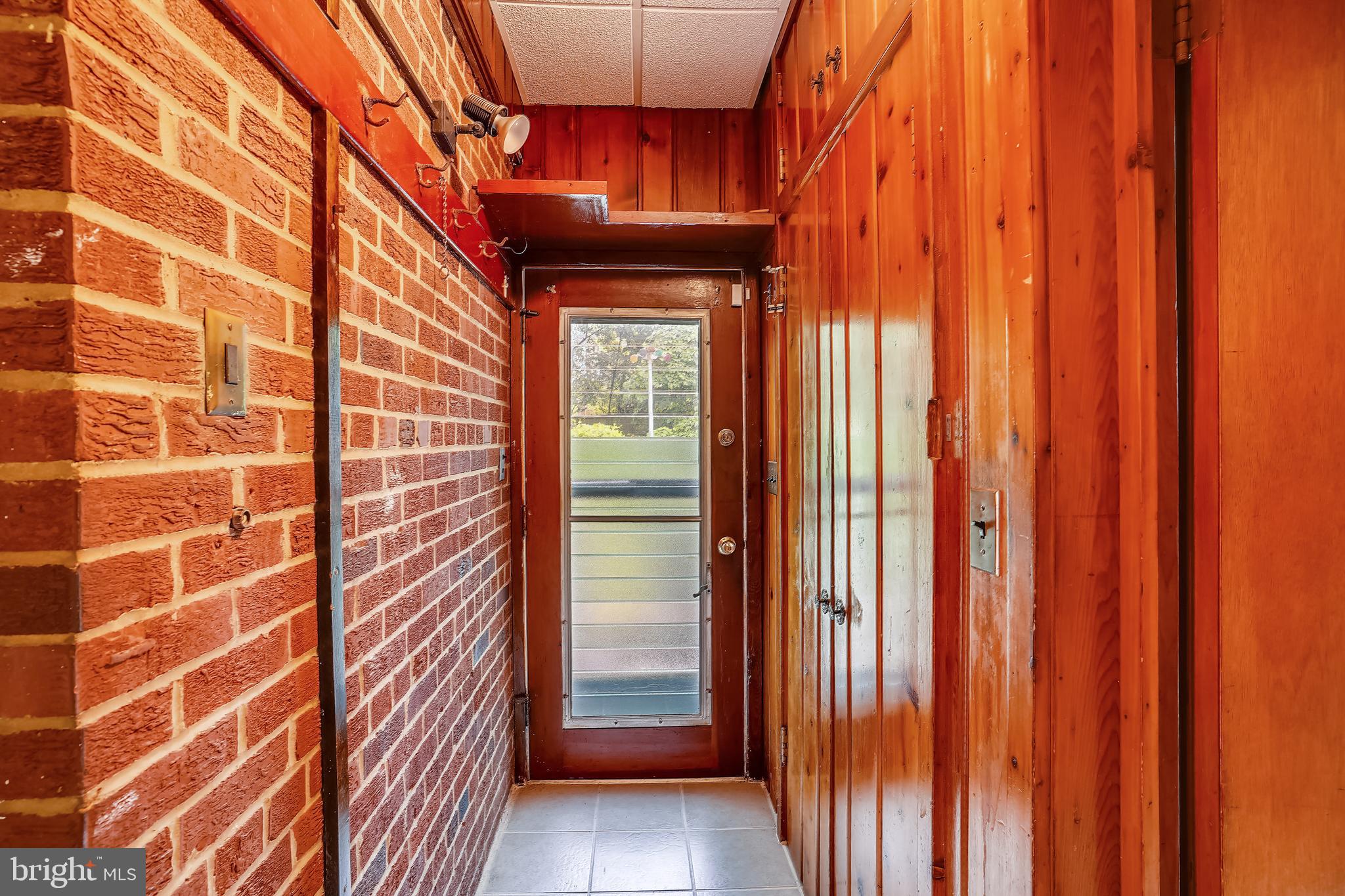 203 East Schuyler Road Silver Spring, MD 20901 - Photo 12 of 37 Hallway to back yard, quality ceramic flooring