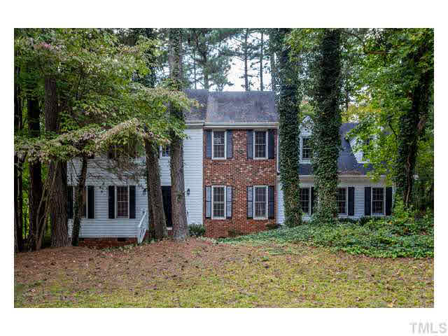 8205 Holly Berry Court Raleigh, NC 27615 - Photo 1 of 24 a view of a brick house with a yard