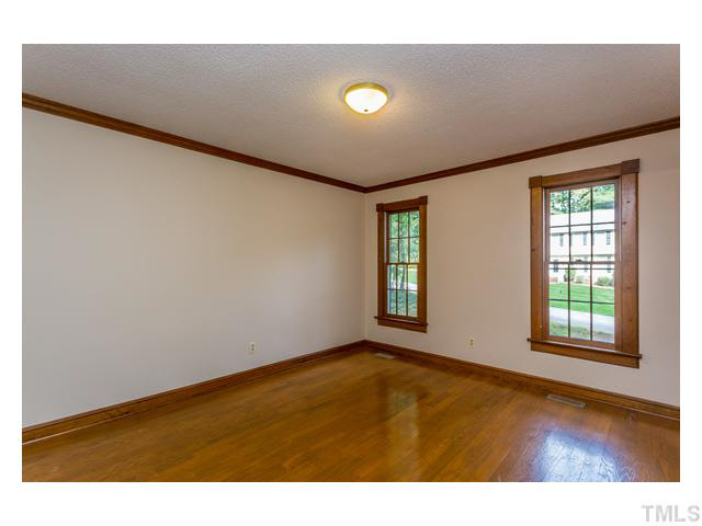 8205 Holly Berry Court Raleigh, NC 27615 - Photo 14 of 24 a view of an empty room with a window