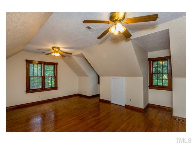 8205 Holly Berry Court Raleigh, NC 27615 - Photo 18 of 24 a view of an entryway with wooden floor