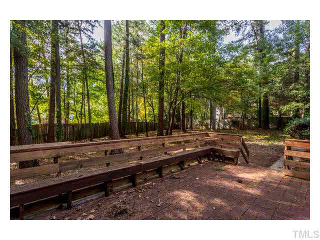 8205 Holly Berry Court Raleigh, NC 27615 - Photo 23 of 24 a backyard of a house with lots of green space