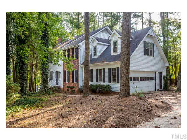 8205 Holly Berry Court Raleigh, NC 27615 - Photo 3 of 24 a view of a yard in front of a house