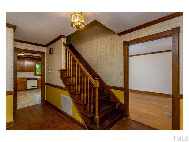 8205 Holly Berry Court Raleigh, NC 27615 - Photo 5 of 24 a view of entryway and hall with wooden floor