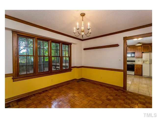 8205 Holly Berry Court Raleigh, NC 27615 - Photo 9 of 24 a view of an empty room with a window