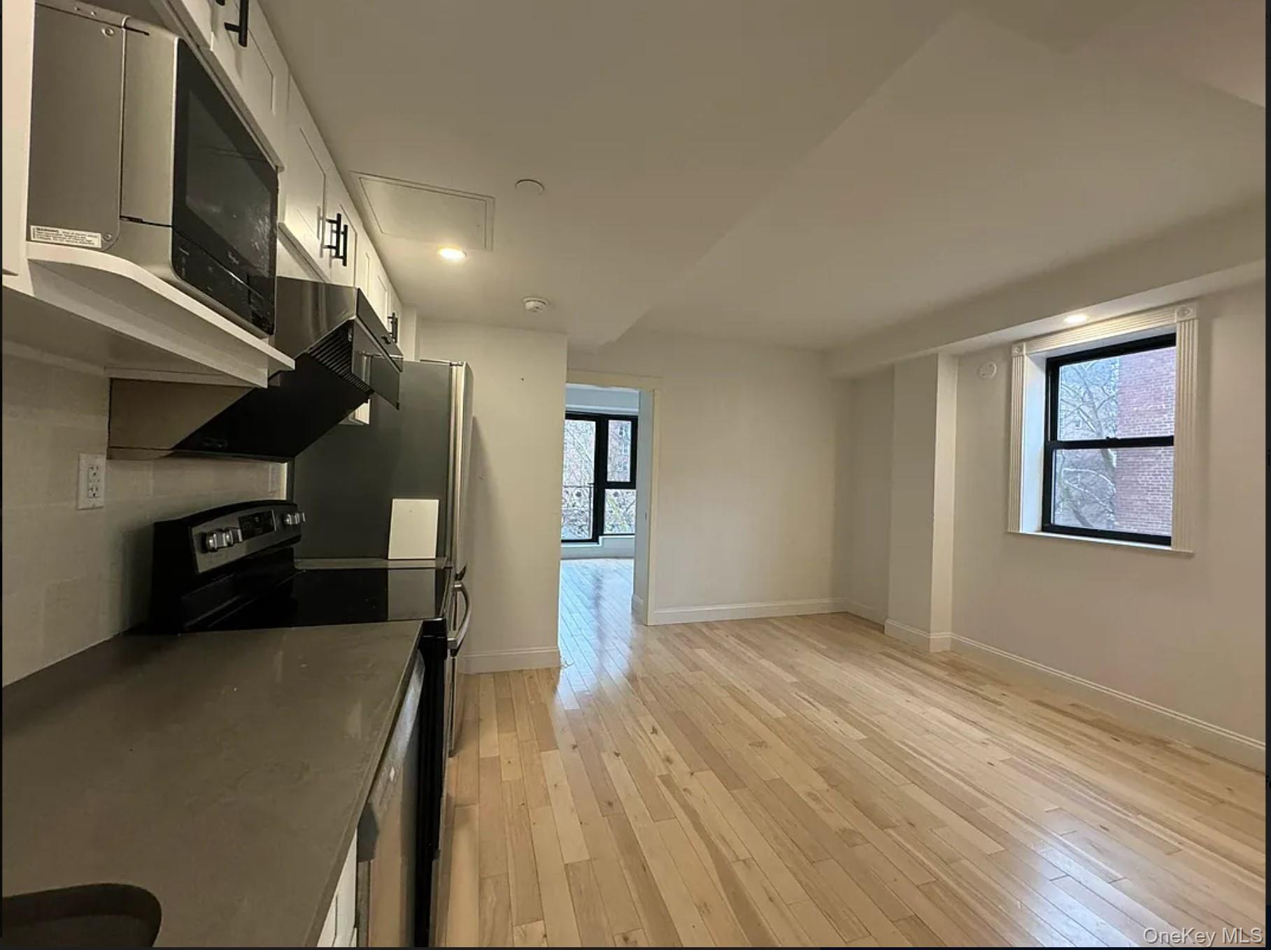 105-25 65th Road, Unit 5C Queens, NY 11375 - Photo 6 of 8 a view of gallery with wooden floor