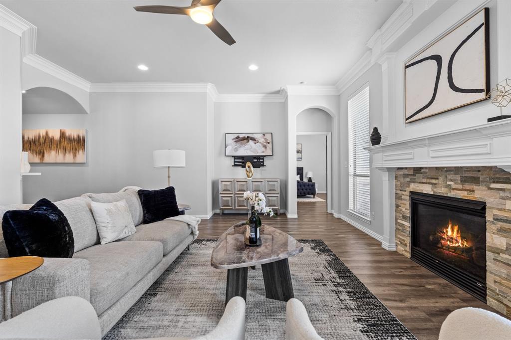 a living room with furniture fireplace and window