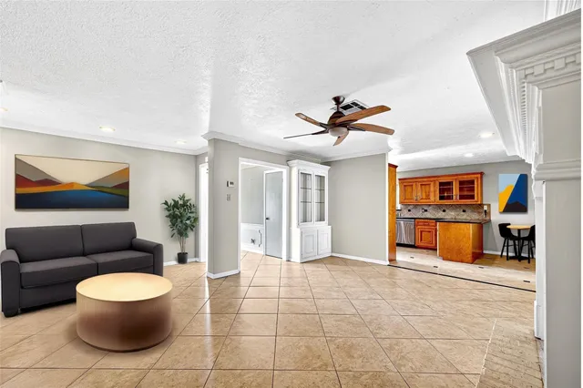 a living room with furniture and a rug