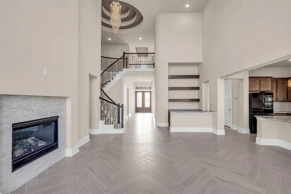 a view of a livingroom with a fireplace a fireplace and entryway