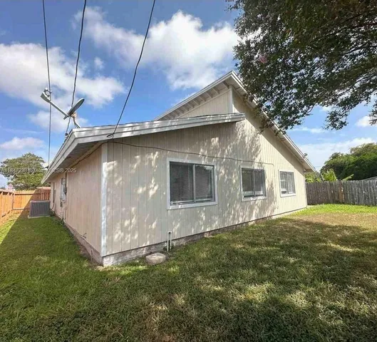 a house view with a backyard space