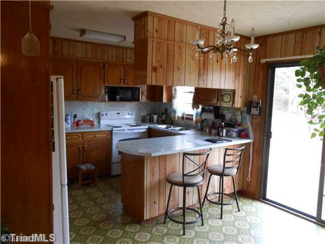 499 Epworth Road Cana, VA 24317 - Photo 4 of 11 Kitchen. Nice Large Kitchen with lots of cabinets. Dining Area w/ Sliding doors to nice new deck