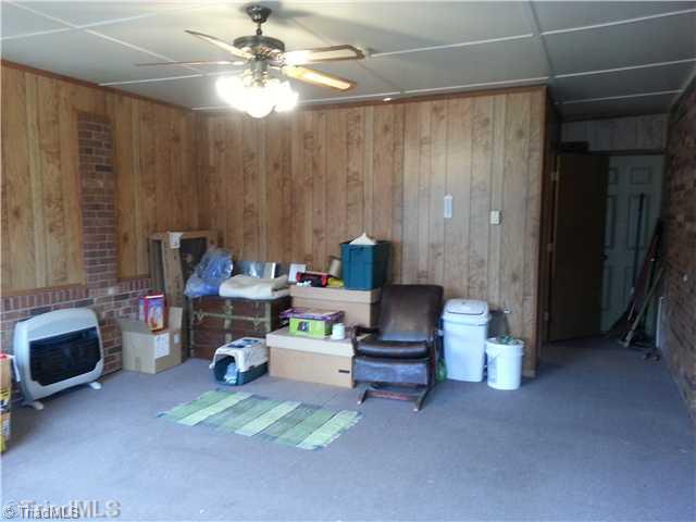 499 Epworth Road Cana, VA 24317 - Photo 7 of 11 Den/Family/Great Room. Nice Large Den- Currently just used for storage. Laundry Room at the back of this room. Great Additional living space.