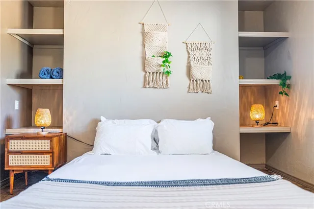 a bedroom with a bed and window