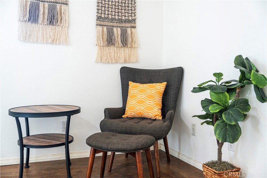 7071 Rubidoux Avenue Yucca Valley, CA 92284 - Photo 24 of 50 a living room with furniture and a potted plant