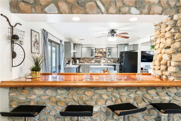 a kitchen with a table and chairs in it