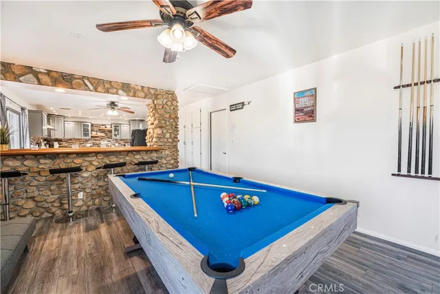 a view of kitchen with furniture and wooden floor