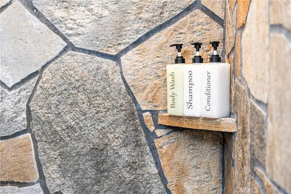 a kitchen with a sink a stove and cabinets