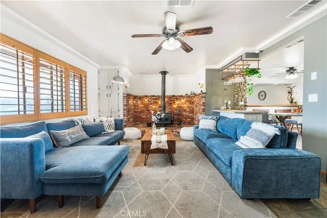 a view of a dining room with furniture and a chandelier